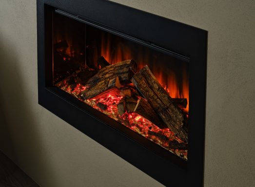 Modern electric fireplace with glowing embers and logs, emitting warm orange light.