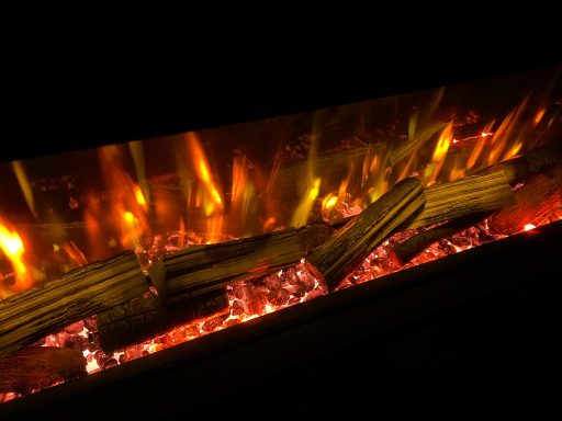 Realistic electric fireplace with glowing logs and vibrant flames.