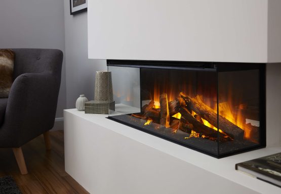 Corner view of New Forest 870 fireplace with glowing logs and flames,.