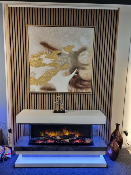 E-FX fire with an art piece above on an acoustic slat wall in our showroom in Alcester