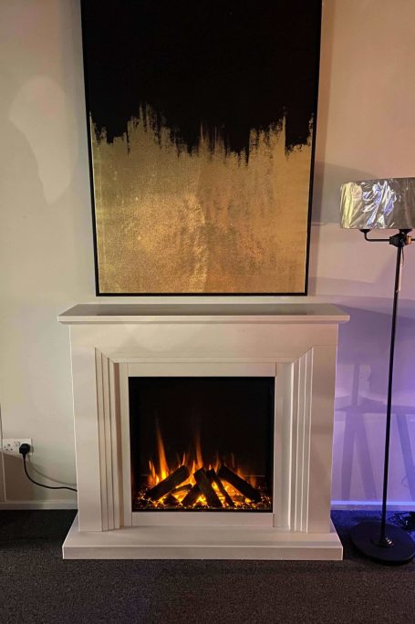 650sq electric fire, by british fires in a stone fireplace. On display in our showroom