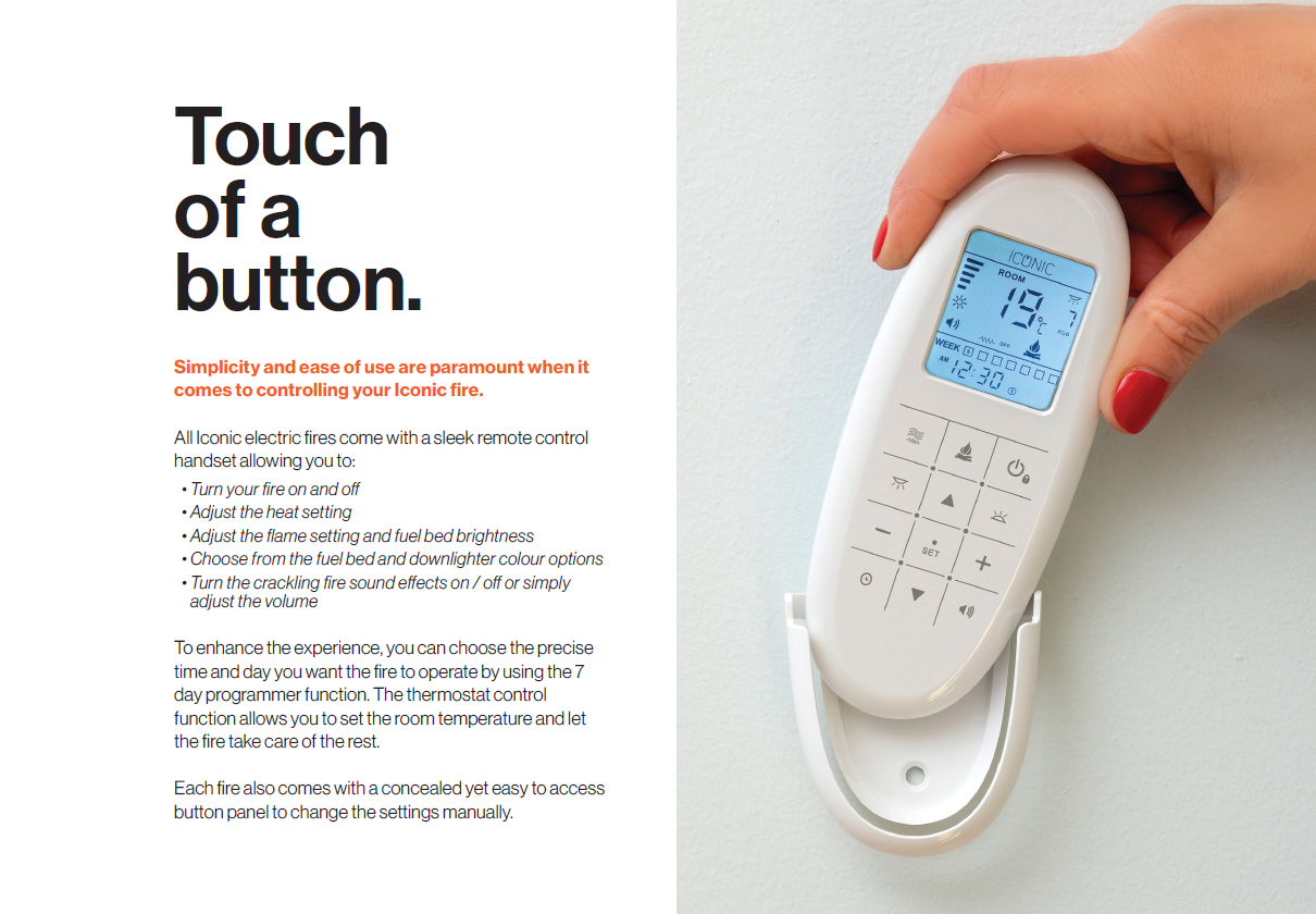 A hand holding a white remote for iconic electric fire, with a digital display and buttons.