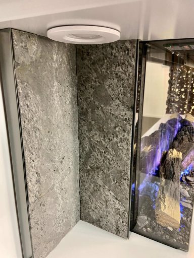 Side view of Flamerite Lazio suite, showing stone effect panels and LED downlight