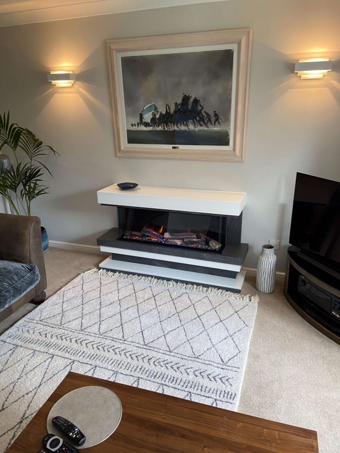 Modern living room featuring a sleek fireplace suite by Flamerite